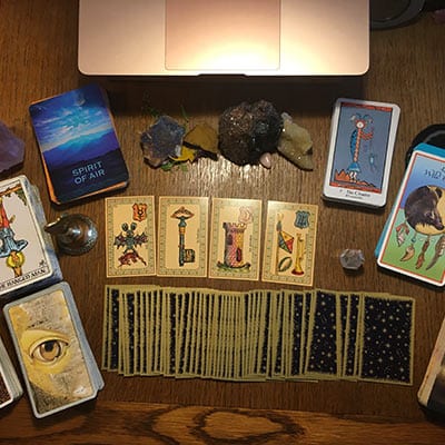 Tools of the online Trade; crystals, tarot & oracle decks; bell for clearing.